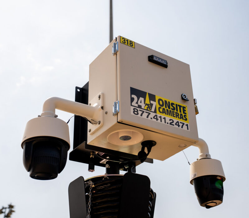 Mounted security cameras and labeled box.