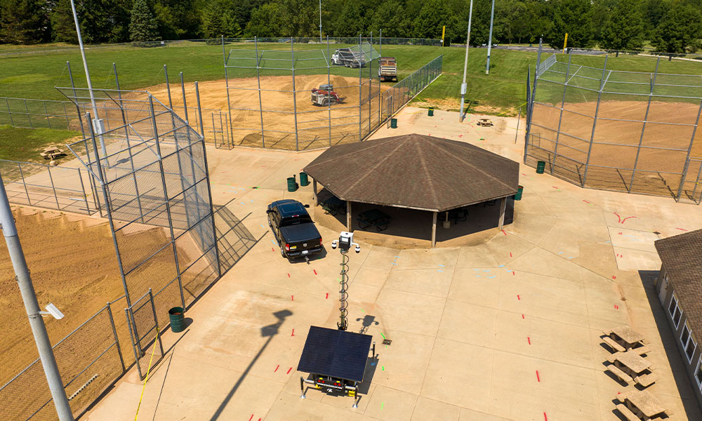 Aerial view of sports complex with baseball fields and pavilion.